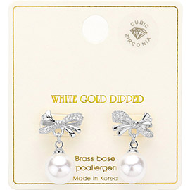 White Gold Dipped CZ Stone Paved Bow Pearl Dangle Earrings